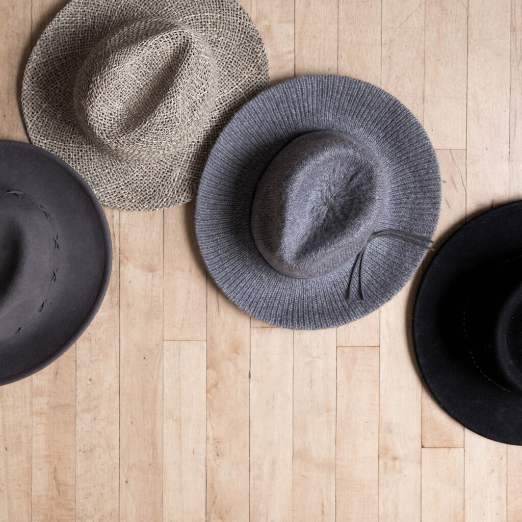 Photo of 4 hats laying on floor