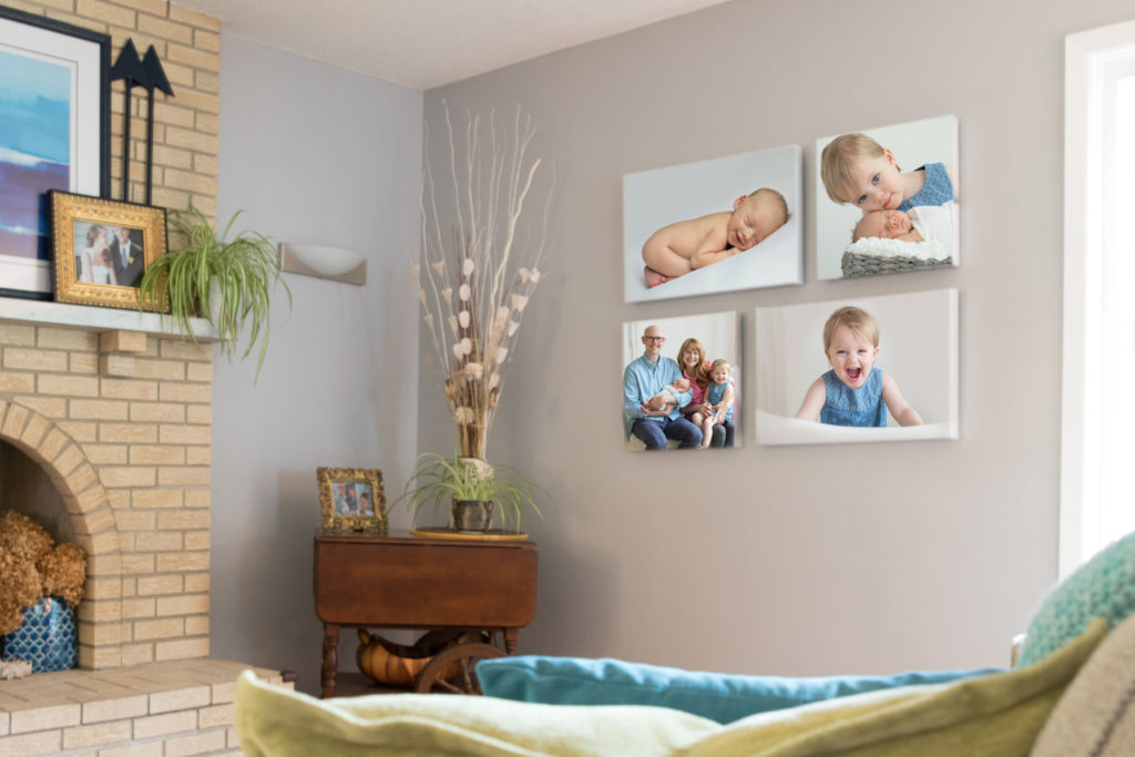 family living room with newborn photography artwork on the wall